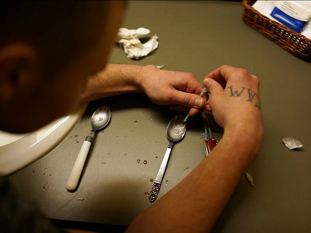 ST. JOHNSBURY, VT - FEBRUARY 06: Drugs are prepared to shoot intravenously by a user addicted to heroin on February 6, 2014 in St. Johnsbury Vermont. Vermont Governor Peter Shumlin recently devoted his entire State of the State speech to the scourge of heroin. Heroin and other opiates have begun …