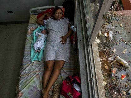 In this Nov. 5, 2016 photo, Virginia Vargas rests with her 1-day-old baby in the maternity