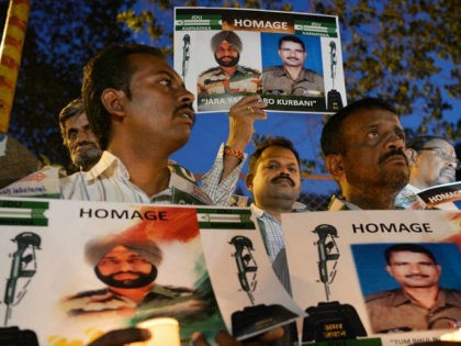 Indian activists stage a candlelight vigil in Bangalore on May 4, 2017, to condemn recent allegations of the mutilation of Indian soldiers' bodies by Pakistani soldiers in the disputed region of Kashmir. The Indian army accused Pakistan on May 1, of killing two of its soldiers and mutilating their bodies …