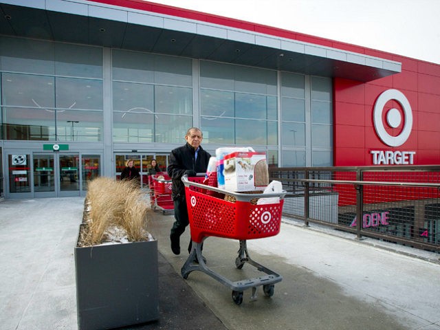 Shoppers exit a Target Corp. store with their shopping carts n Toronto, Ontario, Canada, o