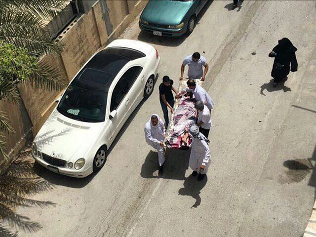 This image provided by an activist who requested to remain unnamed, shows people carrying a man who was injured in a raid on an sit-in, in Diraz, Bahrain, Tuesday, May 23, 2017. Bahrain police raided a town where the sit-in has been going on for months in support of Sheikh …
