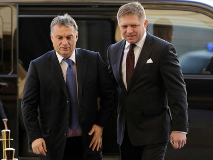 Hungarian Prime Minister Viktor Orban (L) is welcomed by Slovak Prime Minister Robert Fico