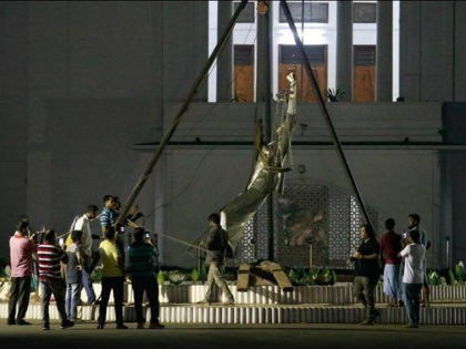 Bangladeshi workers take down a controversial statue on the premises of the country's highest court after Islamist radicals protested for months against what they called an 'un-Islamic' Greek deity on May 26, 2017. Bangladesh on May 26 removed a controversial statue depicting a goddess of justice outside its Supreme Court …