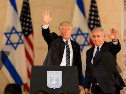 U.S. President Donald Trump and Israeli Prime Minister Benjamin Netanyahu wave at the Isra