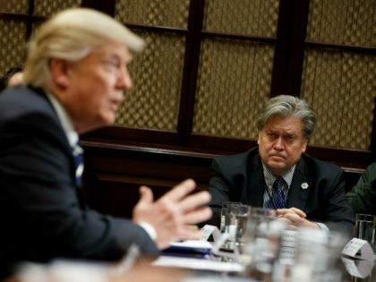 White House Chief Strategist Steve Bannon listens at right as President Donald Trump speaks during a meeting on cyber security in the Roosevelt Room of the White House in Washington, Tuesday, Jan. 31, 2017. (AP Photo/Evan Vucci)