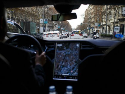 A Tesla Motors Inc. Model S electric automobile, operated Uber Technologies Inc., drives through traffic, in Madrid, Spain, on Friday, Jan. 13, 2017. Ride-hailing service Uber Technologies has launched its first electric car taxi service in Madrid, operating a fleet of Tesla Model S electric vehicles. Photographer: Angel Navarrete/Bloomberg via …