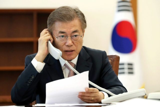 South Korea's new President Moon Jae-In talks to Chinese leader Xi Jinping, at the preside