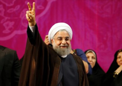 Iran's President Hassan Rouhani appears at a campaign rally in Tehran on May 9, 2017
