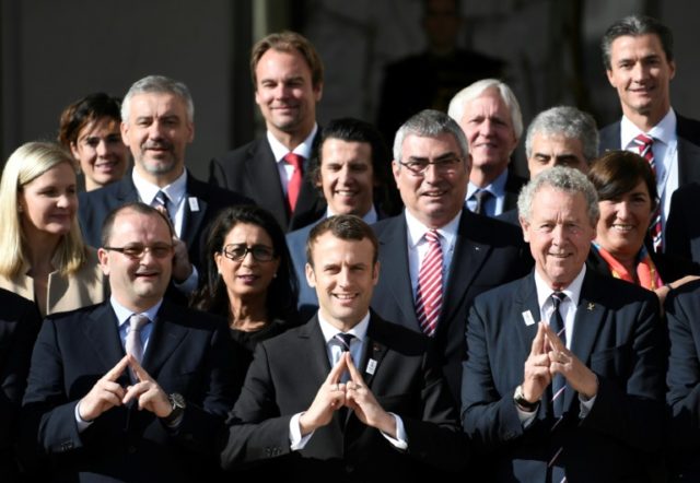 French President Emmanuel Macron (centre) met with members of the International Olympic Co