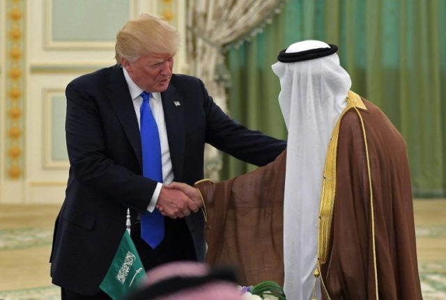 US President Donald Trump (L) shakes hands with Saudi Arabia's King Salman bin Abdulaziz a