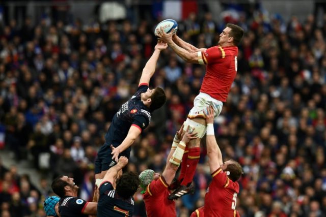 Wales' flanker Sam Warburton (up R) catches the ball in a line-out during the Six Nations