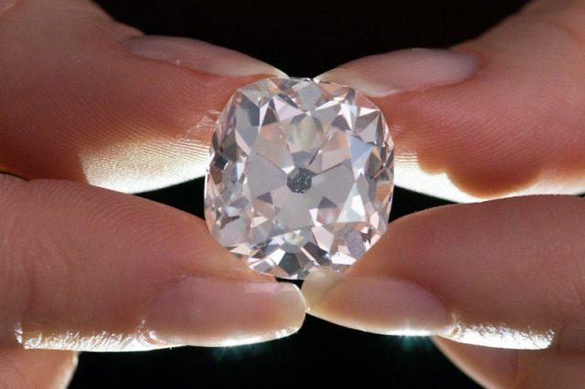 Thought to be worthless costume jewelley, the diamond changed hands at a junk sale for jus