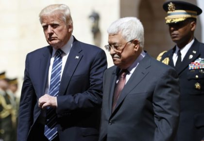 US President Donald Trump (L) is welcomed by Palestinian leader Mahmud Abbas at the presidential palace in the West Bank city of Bethlehem on May 23, 2017