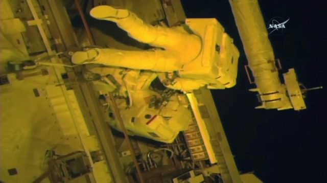 This NASA TV video grab shows astronauts Jack Fischer(top) and Peggy Whitson(below) as the