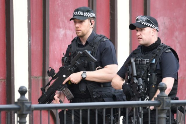Armed police patrol near Manchester Arena on May 23, 2017 following a terror attack the pr