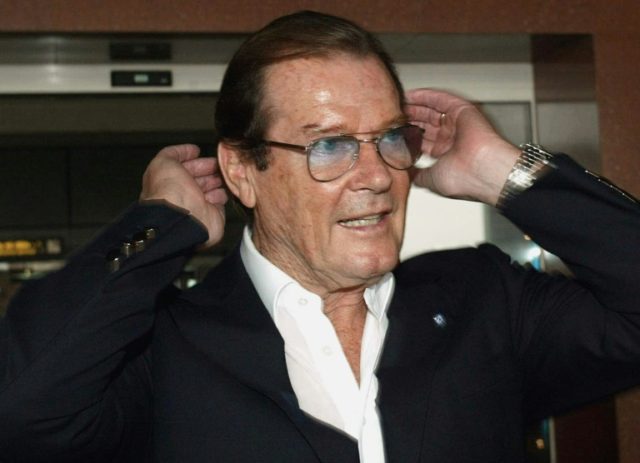 Former James Bond actor Roger Moore pictured at Hanoi airport on October 26, 2003 during a