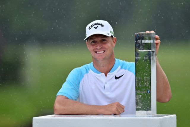 Sweden's Alex Noren poses with the trophy after winning the BMW PGA Championship, at Wentw