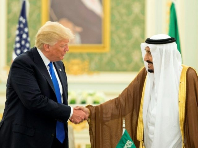 US President Donald Trump (L) and Saudi Arabia's King Salman bin Abdulaziz al-Saud shaking hands during a signing ceremony at the Saudi Royal Court in Riyadh on May 20, 2017