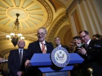 Jeff Merkley, Chuck Schumer, Bernie Sanders The Associated Press