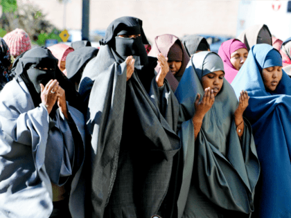 Women in traditional Muslim dress take part in prayers outside the federal courthouse, Oct