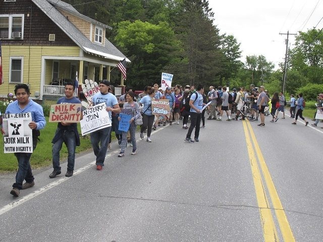 Scores of dairy farm workers and activists marching in Montpelier, Vt., on Saturday June,