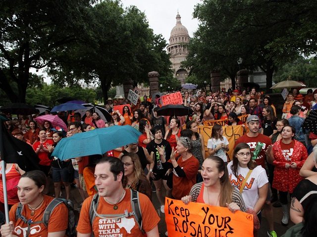Abortion rights demonstrators rally outside of the State Capitol to protest recent legisla