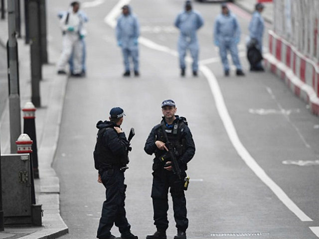 LONDON, ENGLAND - JUNE 04: Armed police officers patrol London Bridge following last night