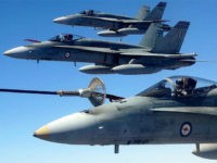 Three Australian Air Force (RAAF) F/A-18 Hornet fighter jets perform air-to-air refuelling while participating in "Exercise Pitch Black" near Darwin in this July 20, 2004 handout photograph. Exercise Pitch Black is a biennial 18-day event and is the Royal Australian Air Force's largest exercise, involving about 1,700 personnel from Singapore, …