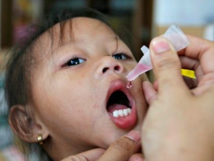 A girl receives anti-measles vaccination drops at a health centre in BASECO compound in Tondo, Manila September 3, 2014. Philippine President Benigno Aquino said on September 1, 2014 between 11 to 13 million people in the country are at risk from measles, polio and rubella (German measles), and asked the …