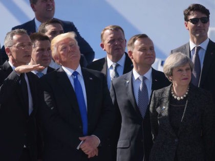 (L-R) NATO Secretary General Jens Stoltenberg, US President Donald Trump and Britain's Prime Minister Theresa May watch a flyover during the handover ceremony at the new NATO Headquarters in Brussels on May 25, 2017. / AFP PHOTO / MANDEL NGAN (Photo credit should read MANDEL NGAN/AFP/Getty Images)