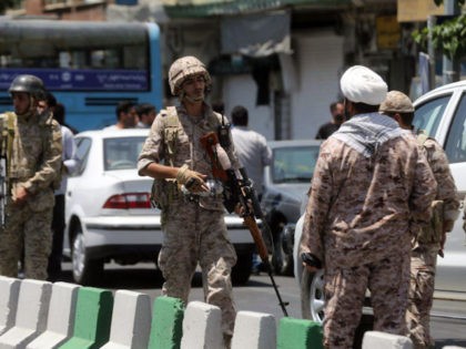 Members of the Iranian Revolutionary Guard secure the area outside the Iranian parliament