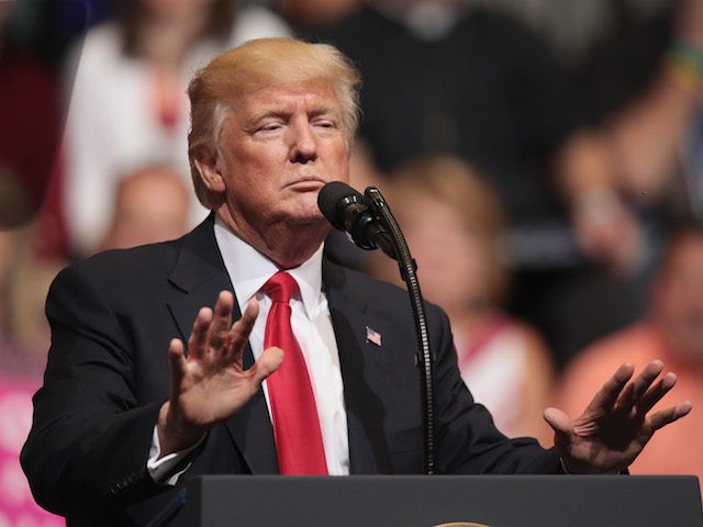 CEDAR RAPIDS, IA - JUNE 21: President Donald Trump speaks at a rally on June 21, 2017 in Cedar Rapids, Iowa. Trump spoke about renegotiating NAFTA and building a border wall that would produce solar power during the rally. (Photo by Scott Olson/Getty Images)