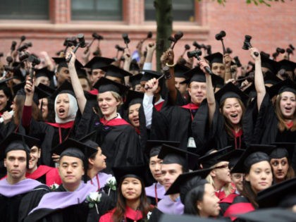CAMBRIDGE, MA - JUNE 5: Graduating Harvard University Law School students stand and wave gavels in celebration at commencement ceremonies June 5, 2008, in Cambridge, Massachusetts. J.K. Rowling, who wrote the popular Harry Potter books, was the commencement speaker. (Photo by Robert Spencer/Getty Images)