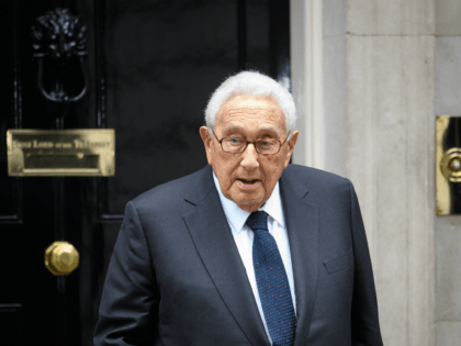 Former US Diplomat Henry Kissinger leaves following a meeting with British Prime Minister