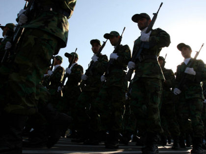 ** FILE ** Members of Iranian Corps Guards of the Islamic Revolution forces parade during