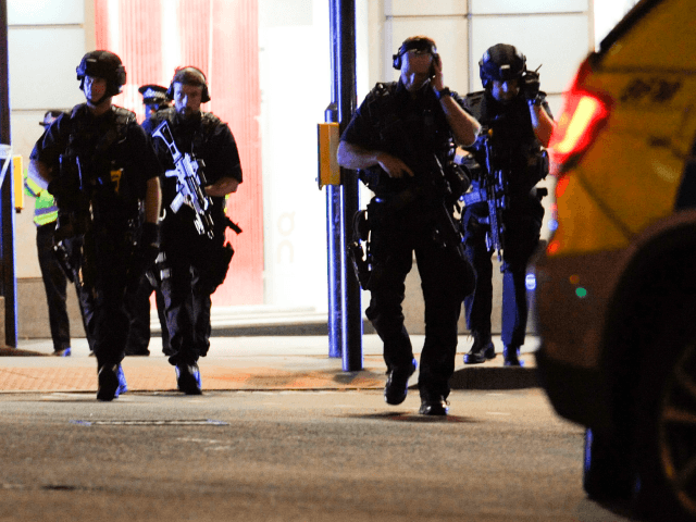 Armed police take position at the scene of a terror attack on London Bridge in central Lon
