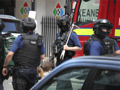 Counter terrorism officers are seen near the scene of last night's London Bridge terr