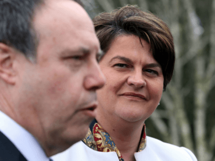 Democratic Unionist Party (DUP) leader Arlene Foster (R), and DUP Deputy Leader Nigel Dodds address the media outside the Parliament Buildings at Stormont in Belfast on March 6, 2017.