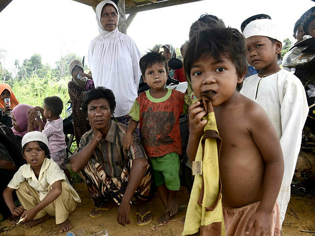 This photo taken on May 19, 2017 shows families from the 'Orang Rimba' tribe -- whose name