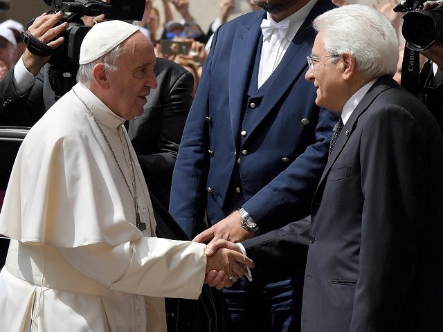 ITALY-VATICAN-DIPLOMACY-RELIGION-POPE Pope Francis (L) shakes hands with Italian President Sergio Mattarella upon his arrival fo