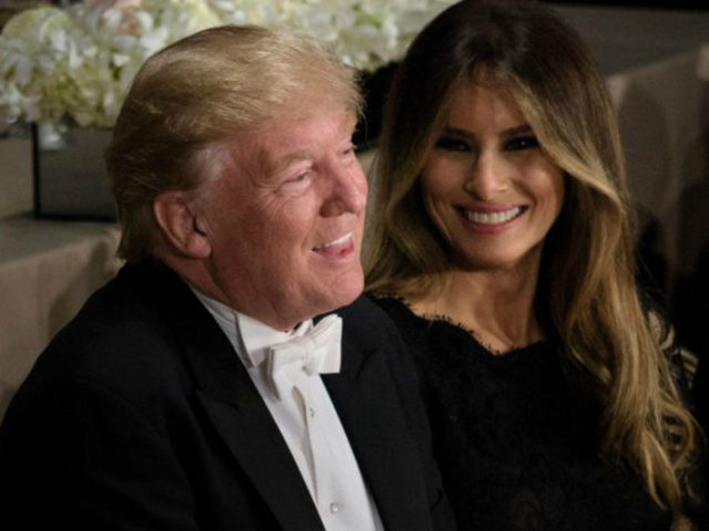 Republican presidential nominee Donald Trump and Melania Trump laugh during the Alfred E.