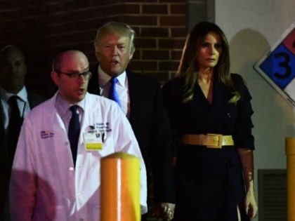 Dr. Ira Rabin (L) escorts US President Donald Trump and First Lady Melania Trump from MedS
