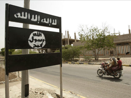 FILE - In this Friday, June 15, 2012 file photo, an al-Qaida logo is seen on a street sign