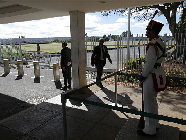 Security officers stand guard at the main entrance of the Alvorada Palace after a minor ra