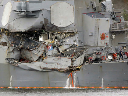 In this June 18, 2017 file photo, damaged section of the USS Fitzgerald is seen at the U.S. Naval base in Yokosuka, southwest of Tokyo. The U.S. Navy has identified the seven sailors who died when their destroyer collided with a container ship off Japan on Saturday.(AP Photo/Eugene Hoshiko, File)