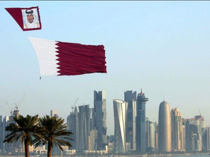 DOHA, QATAR - DECEMBER 18: Qatar Air Forces unfurl the flag of Qatar during the 137th anniversary celebrations of the Qatar's National Day in Doha, Qatar on December 18, 2015. Thousands of people have gathered along Doha's waterfront to celebrate Qatar's National Day. The annual holiday marks the date in …