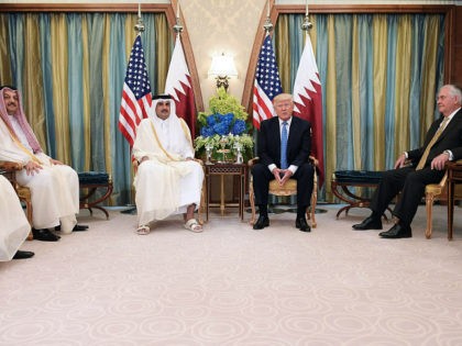 US President Donald Trump (C-R) and Qatar's Emir Sheikh Tamim Bin Hamad Al-Thani (C-L) tak