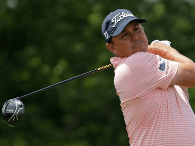 Jason Dufner of the US hits his tee shot on the first hole during the final round of the M