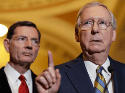 In this May 23, 2017, file photo, Senate Majority Leader Mitch McConnell of Ky., right, accompanied by Sen. John Barrasso, R-Wyo., speaks on Capitol Hill in Washington. The Republican effort to secretly craft a health care bill and whisk it through the Senate is striking, and it’s drawing fire from …
