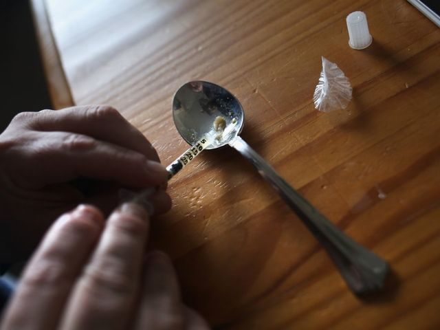 NEW LONDON, CT - MARCH 23: A heroin user prepares to inject himself on March 23, 2016 in New London, CT. Communities nationwide are struggling with the unprecidented heroin and opioid pain pill epidemic. On March 15, the U.S. Centers for Disease Control (CDC), announced guidelines for doctors to reduce …